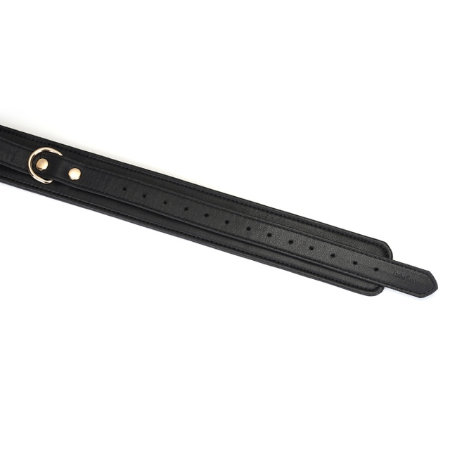 Wykwintne kajdanki na uda z licowej ścisłej skóry bydlęcej w kolorze głębokiej czerni z okuciami  z metalu w kolorze złota rozmiar M/L obwód max 81 cm