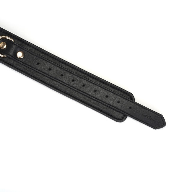 Wykwintne kajdanki na uda z licowej ścisłej skóry bydlęcej w kolorze głębokiej czerni z okuciami  z metalu w kolorze złota rozmiar M/L obwód max 81 cm